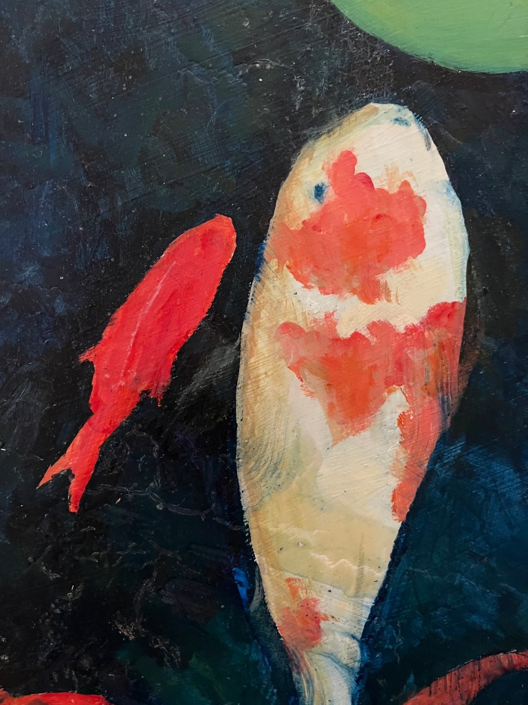 One Koi and one red fish in dark pool